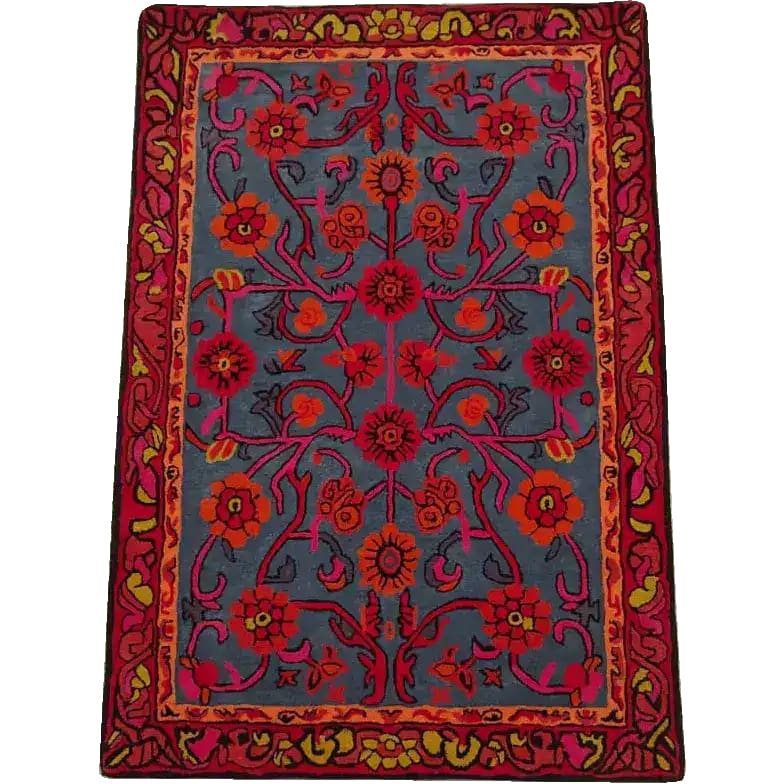 Vibrant Red Bloom Harmony area rug, hand-tufted with intricate floral patterns. Perfect for adding a vintage touch to your dining room or living room. This 8x10 wool rug features rich reds and blues, ideal for those seeking a stylish floral rug.