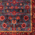 Vibrant Red Bloom Harmony Hand Tufted Area Rug featuring a striking floral design with rich red and orange flowers on a deep blue background. Perfect for adding a touch of vintage charm to your dining room or living room. This 8x10 wool rug is an elegant choice for dining room area rugs or living room rugs.