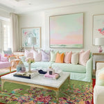 A colorful and elegant living room featuring a Red Bordered Spring Floral in the Green Sky Wool Hand Knotted Area Rug. This luxurious area rug enhances the space with its vibrant floral pattern and rich textures, making it a perfect choice for living room area rugs and adding a touch of sophistication to rugs for living room decor.