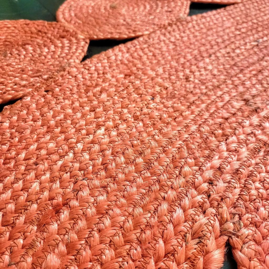 Close-up view of a Red Classic Circles Round Jute Rug with intricate woven texture, perfect for living room and bedroom settings. This 9' x 9' area rug adds a touch of elegance to any space, ideal as a living room rug or a bedroom area rug.
