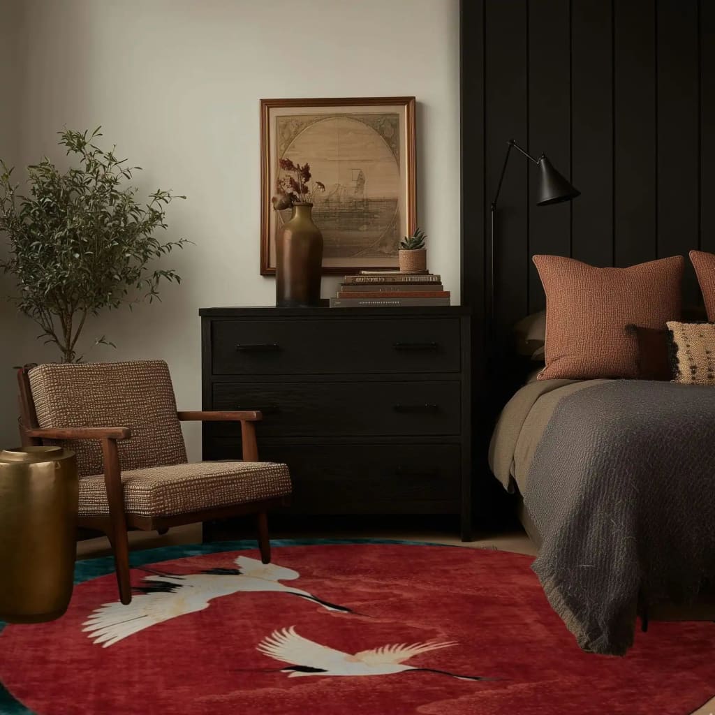 Elegant living space featuring a Red Flying Japanese Cranes Hand Tufted Area Rug. This wool rug, perfect for living rooms or offices, showcases beautiful crane motifs on a rich red background. The stylish round rug complements the cozy decor, enhancing the room's warmth and inviting ambiance.