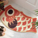 A vibrant red oriental fish-shaped area rug placed at the entrance of a living room, showcasing its bold design. Perfect for those seeking unique living room area rugs. This rug adds an artistic flair, ideal for spaces needing an 8x10 floor covering.
