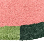 Close-up view of the Red Twin Flowers Hand Tufted Wool Rug, showcasing its vibrant pink and green color blocks, perfect as a contemporary area rug for large living rooms and dining rooms. This wool rug adds a touch of elegance to any living space, especially suitable as an 8x10 living room rug.