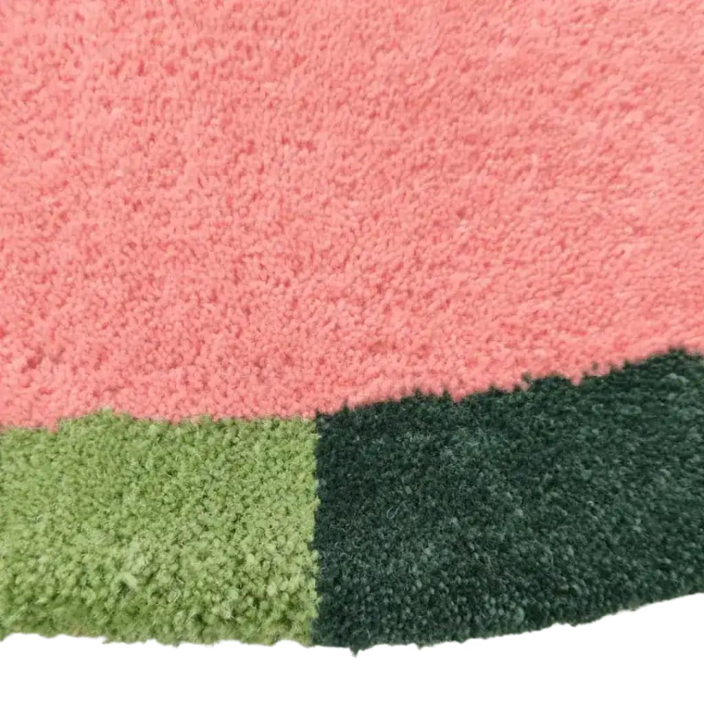 Close-up view of the Red Twin Flowers Hand Tufted Wool Rug, showcasing its vibrant pink and green color blocks, perfect as a contemporary area rug for large living rooms and dining rooms. This wool rug adds a touch of elegance to any living space, especially suitable as an 8x10 living room rug.