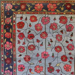 The Red Velvet Bloom Hand Knotted Area Rug showcases a stunning floral design with vibrant red and pink flowers against a soft background. Perfect for adding a vintage touch to any space, this 8x10 Persian-style rug is ideal for living rooms seeking a blend of elegance and classic charm.