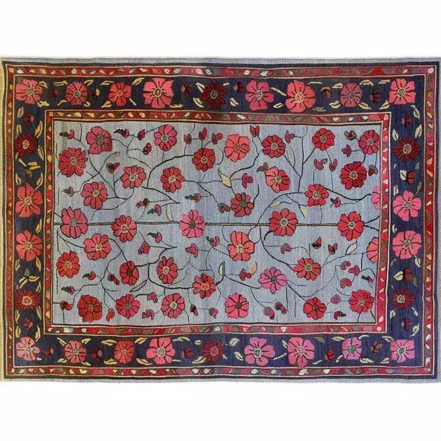 The Red Velvet Bloom Hand Knotted Area Rug showcases an intricate floral design with vibrant red and pink blooms set against a muted background, ideal for adding a touch of elegance to any living room. This 8x10 vintage rug embodies a classic Persian style, perfect for those seeking a stylish floral or living room area rug.