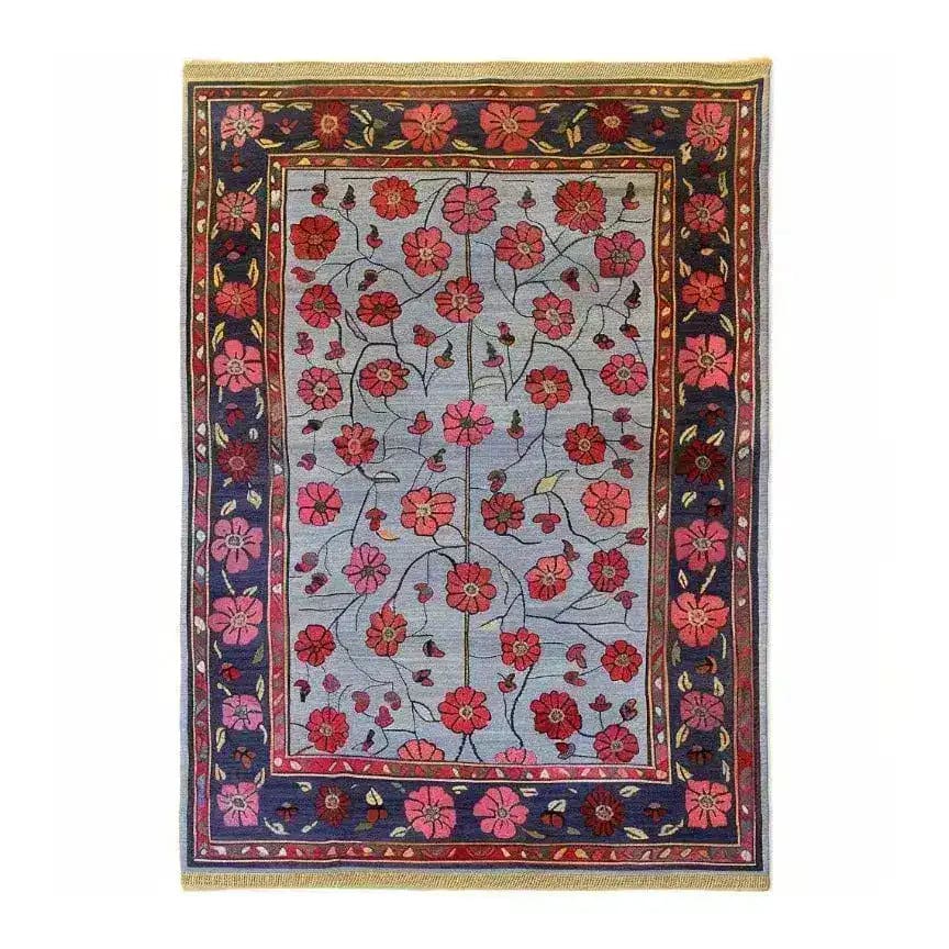 The Red Velvet Bloom Hand Knotted Area Rug showcases a vintage Persian design with vibrant floral patterns. Perfect for adding elegance to living rooms, this 8x10 area rug features intricate red and pink flowers on a subtle background, bordered by a rich, decorative frame.