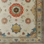 This elegant area rug features a regal blossom medallion design, showcasing intricate Persian patterns in vibrant red, blue, and earthy tones. Perfect for adding a vintage charm to your living room, this large rug is hand-knotted with exquisite detail, making it a stunning centerpiece for any space.