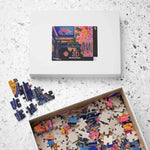 White Regal Eclectic Puzzle box with image label on terrazzo surface beside open box overflowing with loose colorful pieces