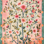 A vibrant hand-tufted area rug featuring a detailed floral design with pink blossoms and green leaves on a soft gradient background. Ideal for large living rooms or offices, this vintage wool rug adds a touch of elegance and warmth, perfect for enhancing your space with a classic floral motif.