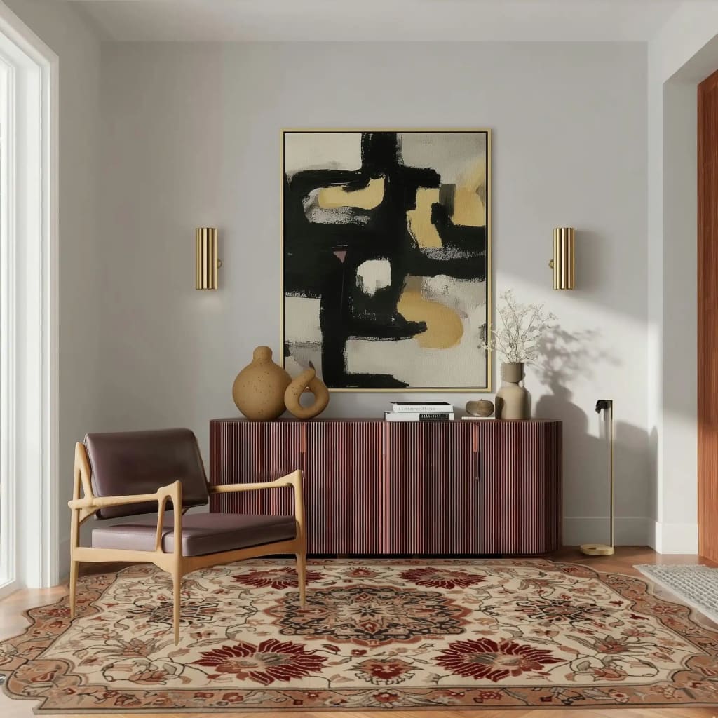 A cozy living room featuring a Regal Petal Hand-Tufted Area Rug with intricate vintage patterns, crafted from high-quality wool. This large living room rug adds warmth and elegance, complementing the modern decor with a wooden chair and abstract wall art.