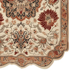 Close-up of the Regal Petal Hand-Tufted Area Rug showcasing intricate vintage floral patterns in rich red and beige tones. This wool rug is perfect for adding elegance to large living rooms.