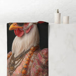 Regal Renaissance Chicken bath towel draped over bathtub edge in white bathroom showing rooster portrait print