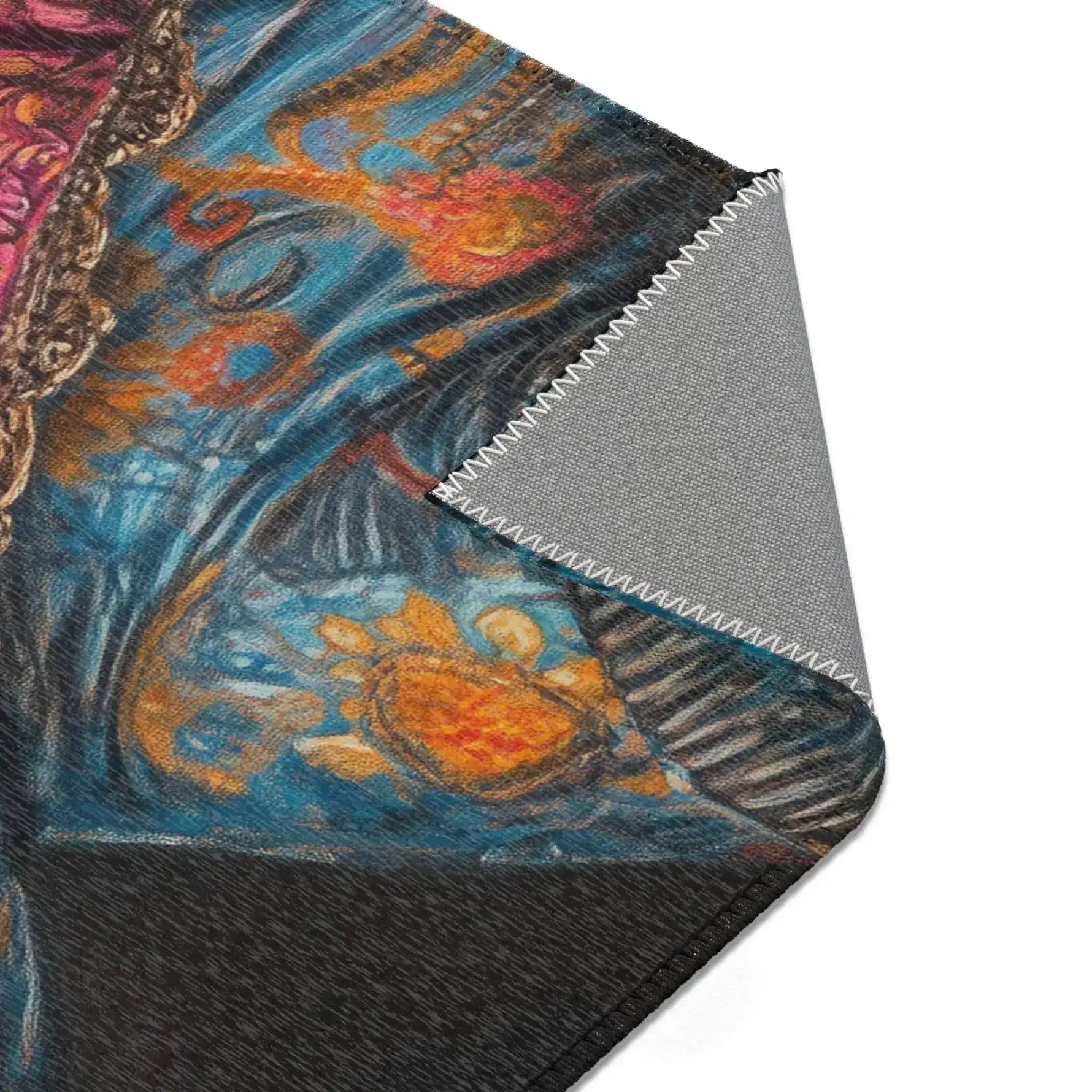 Folded corner of the Regal Renaissance Chihuahua rug showing blue orange floral jacket and pink frilled collar detail with grey non-slip backing and zigzag seam