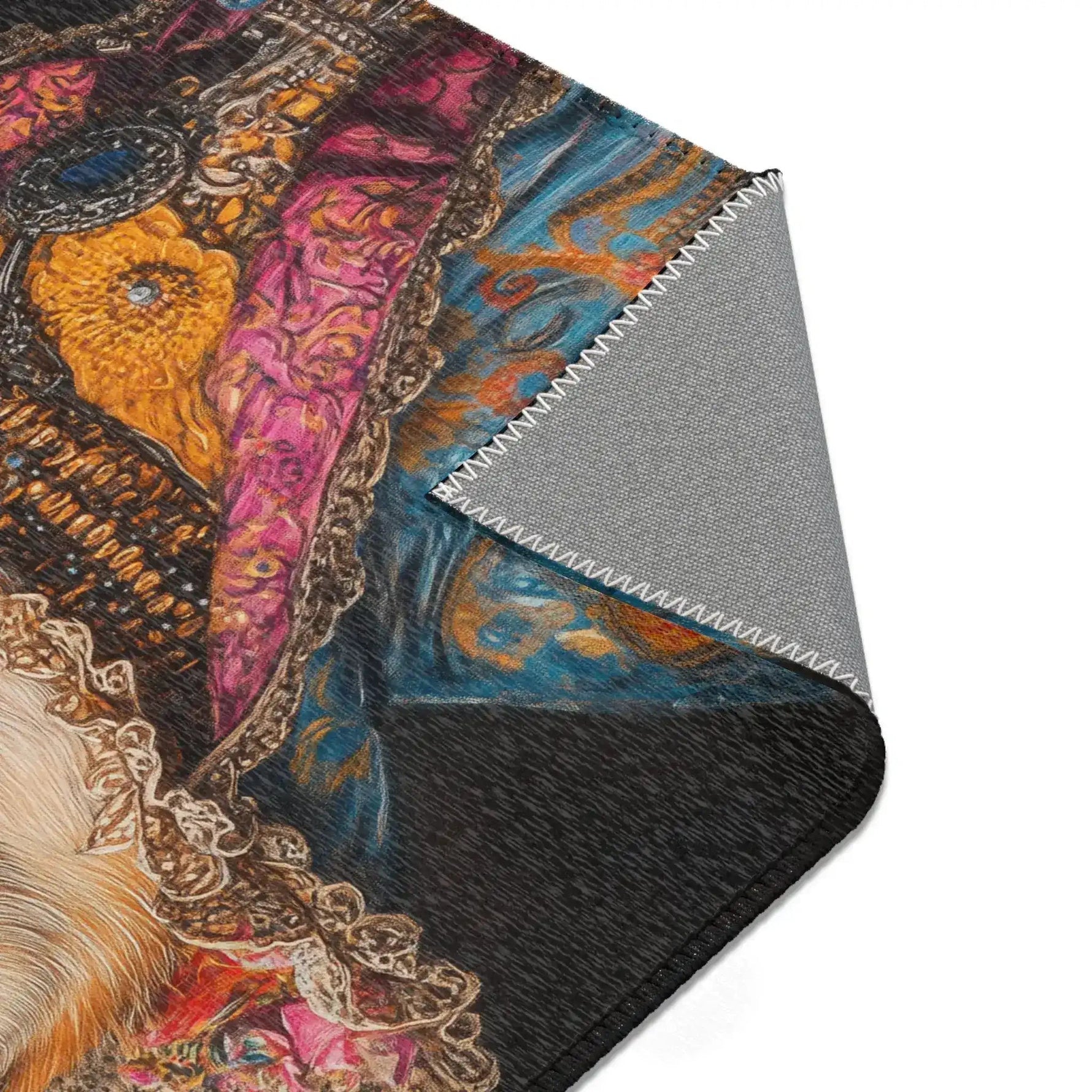 Folded corner of the Regal Renaissance Chihuahua rug showing gold brooch pink embroidered vest and blue floral coat with grey non-slip backing