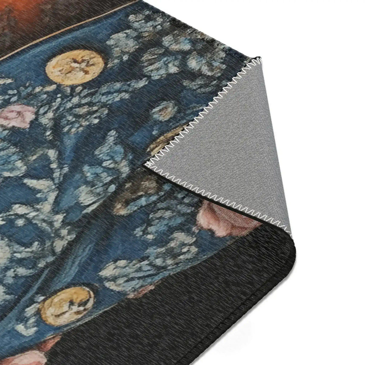 Corner fold detail of Regal Renaissance Pup Couture Dog Art Accent Rug with blue floral brocade gold coin buttons and grey anti-slip backing
