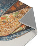 Close-up corner fold of Regal Reptile Renaissance Rug showing baroque gold scrollwork and blue brocade coat detail and gray backing