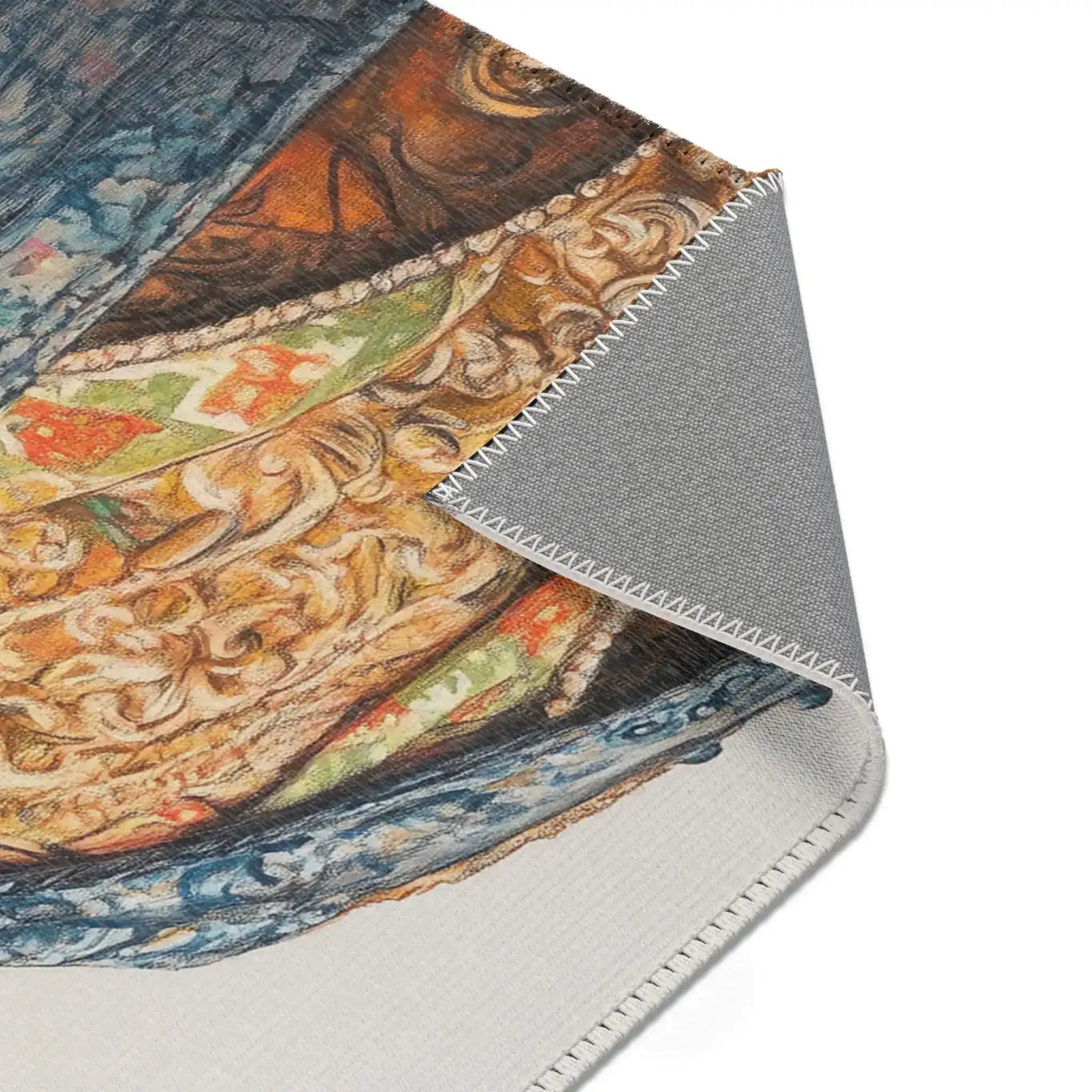 Close-up corner fold of Regal Reptile Renaissance Rug showing baroque gold scrollwork and blue brocade coat detail and gray backing