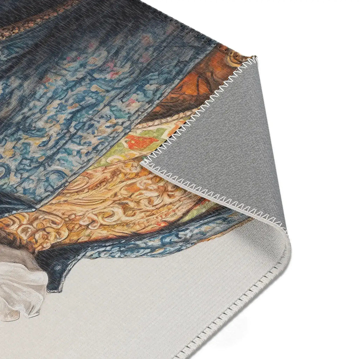 Corner fold of Regal Reptile Renaissance Rug showing blue brocade coat and gold ornamental details with ruffled collar and gray backing