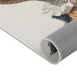 Rolled corner of Regal Reptile Renaissance Rug showing off-white face side with colored baroque portrait print and gray backing