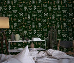 Vintage insect lattice wallpaper vignette, gold and cream moths and flora framing a wood side table