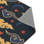 Retro Night Sky Accent Rug curled corner revealing navy field with stars, moons and grey underside