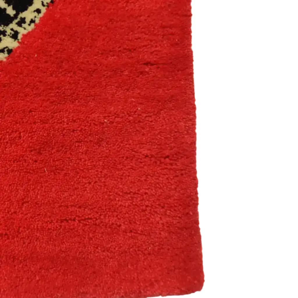 Close-up view of the Retro Red Snake Hand Tufted Wool Rug, showcasing its vibrant red color and intricate snake design. Perfect for adding a vintage touch to dining rooms or large living rooms, this wool rug is an ideal choice for formal dining room settings.