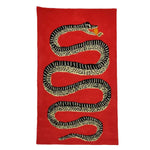 A striking Retro Red Snake Hand Tufted Wool Rug featuring a bold snake design on a vibrant red background. This eye-catching area rug is perfect for adding a vintage touch to a large living room or formal dining room, enhancing the space with its unique style and high-quality wool texture.