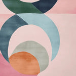 A vibrant Retroform Celestial Pop Hand Tufted Area Rug featuring an abstract design with bold curves and colors like green, blue, and orange against a soft pink background. This contemporary wool rug is perfect for adding a pop of color to any living room, making it an ideal choice for area rugs in modern home decor.