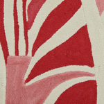 Close-up of a red and beige patterned rug