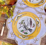 ribboned radiance placemat white lilac gold ribbon bow embroidery border yellow bird plate antler cutlery rustic wood table