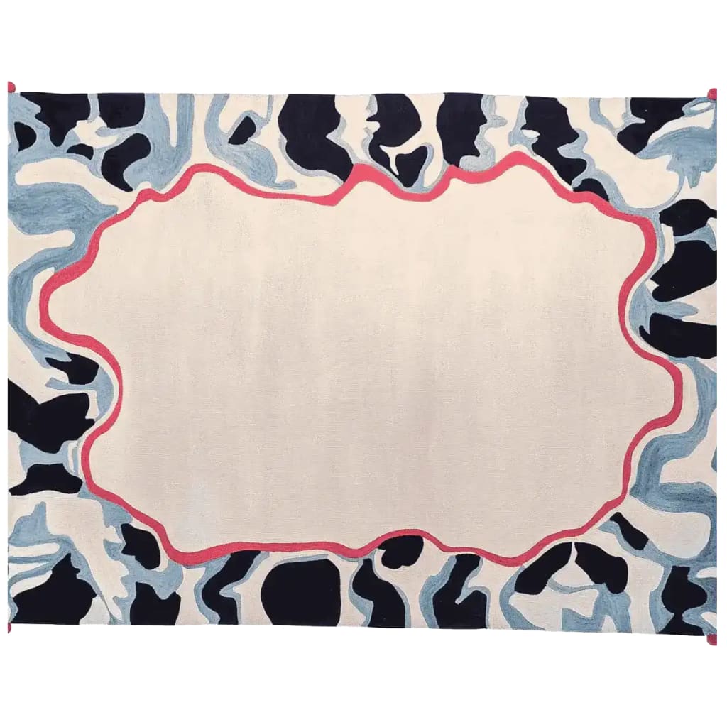 A contemporary area rug showcasing a unique ripple memory frame design. The rug features a hand-tufted pattern with an abstract border in shades of blue and black, accented by a striking red outline. Made from high-quality wool, this large living room rug adds a modern touch to any space.