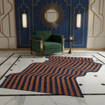 Modern interior with a green armchair, striped rug, and decorative wall mirror.