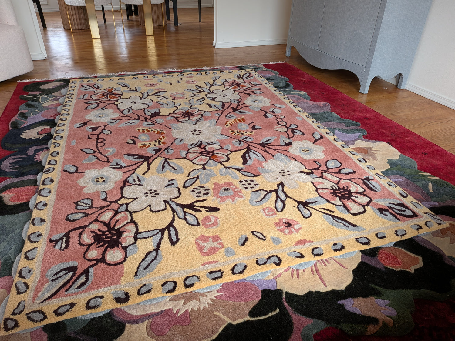 Floral patterned rug on a wooden floor