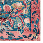 Vibrant hand-tufted area rug featuring an abstract design with a tiger and floral patterns, perfect as a large living room rug. This square wool rug offers a colorful blend of blue, pink, and beige hues, adding a bold statement to any space, ideal for those seeking unique rugs for living room decor.