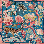 Vibrant Roar & Bloom Hand Tufted square area rug featuring a bold abstract design of tigers and blooming florals on a rich blue background, perfect for adding a touch of art to large living room spaces. This wool rug includes a harmonious mix of pink, green, and cream colors, making it an ideal choice for stylish rugs for living room decor.