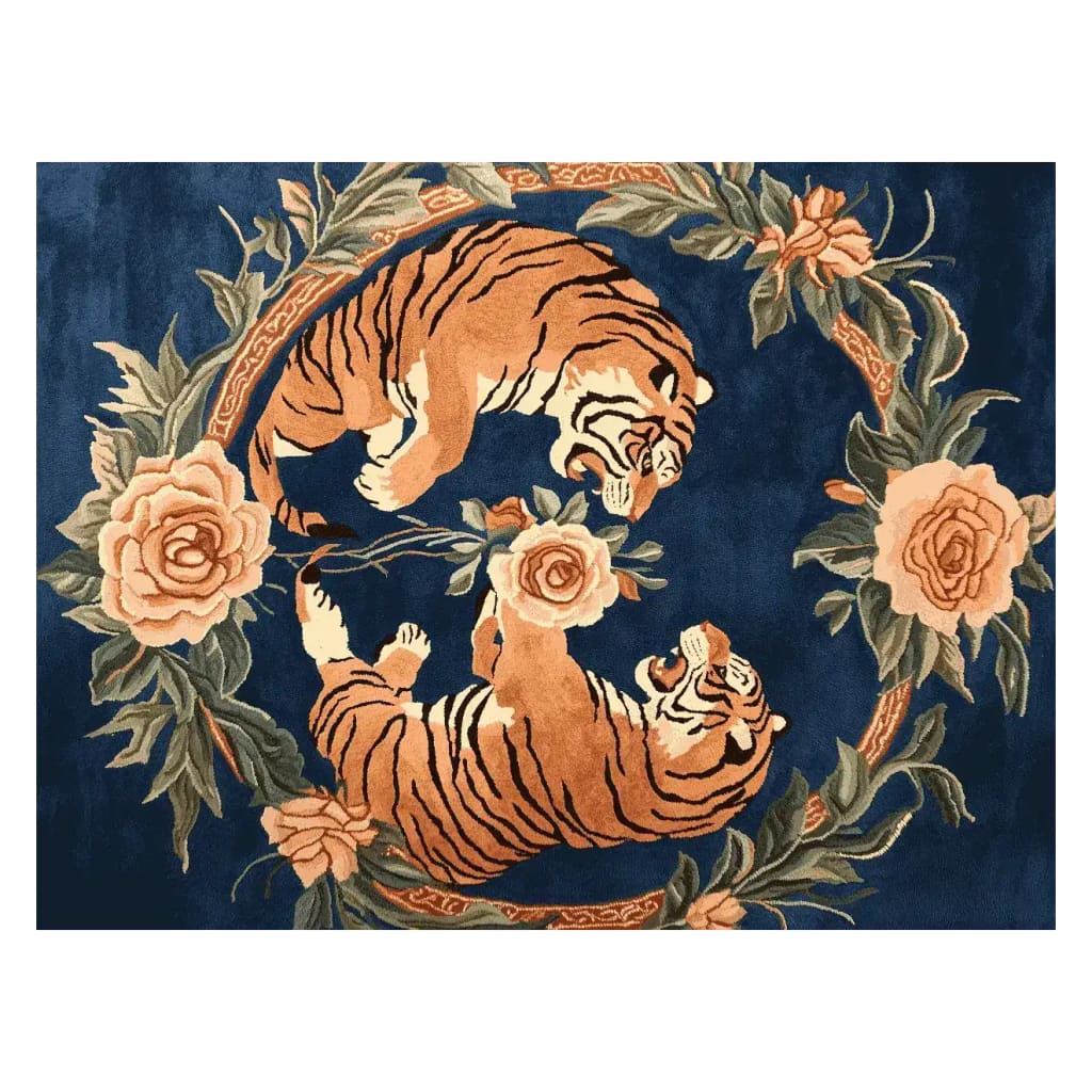 A stunning area rug featuring an intricate design of two roaring tigers surrounded by lush floral patterns on a deep blue background. Perfect for large living rooms, this 8x10 wool rug combines the elegance of a vintage rug with the vibrant colors of a floral rug, adding a bold statement to any space.