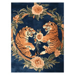 A stunning Roaring Rivalry Hand Tufted Rug featuring a bold design of two tigers surrounded by intricate floral patterns on a deep blue background. This vintage wool rug is perfect for large living rooms, offering an elegant touch to any space. Ideal for those seeking an 8x10 area rug that combines artistry with functionality.
