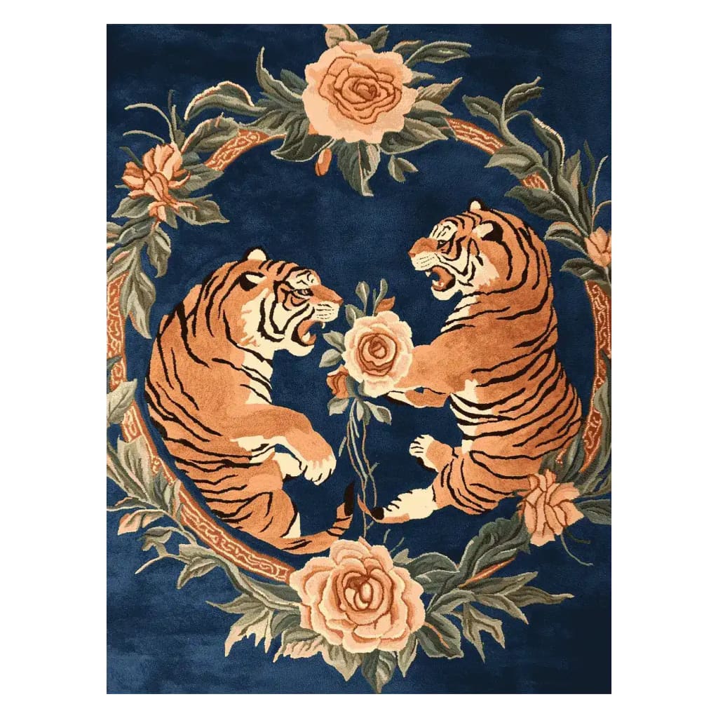A stunning Roaring Rivalry Hand Tufted Rug featuring a bold design of two tigers surrounded by intricate floral patterns on a deep blue background. This vintage wool rug is perfect for large living rooms, offering an elegant touch to any space. Ideal for those seeking an 8x10 area rug that combines artistry with functionality.