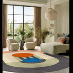 A stylish area rug in a contemporary living room, featuring a geometric design with vibrant colors. The wool rug complements the modern decor, making it ideal as a large living room rug and a centerpiece for area rugs in the living room.