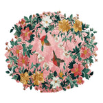 Vibrant hand-tufted area rug featuring a floral design with colorful birds and lush green leaves on a pink background, perfect for large living rooms. This wool rug combines elegance and warmth, making it an ideal choice for area rugs in the living room.