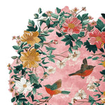 A vibrant area rug featuring a lush floral design with colorful birds set against a soft pink background. This hand-tufted wool rug showcases intricate details with blooming flowers in yellow, white, and pink, complemented by green leaves. Ideal for large living rooms, this floral rug adds a touch of elegance and warmth, perfect for those seeking beautiful area rugs for living room decor.