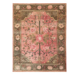 The Rosaire Grandeur Knotted Wool Rug features a beautifully intricate floral design, perfect as an area rug to enhance your living room decor. The rich pink and earthy tones create a warm and inviting atmosphere, making it an ideal floral rug choice.