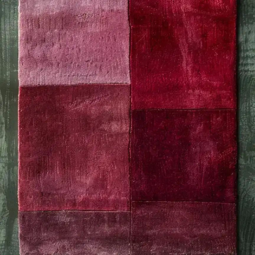 A vibrant Rose Luxe Hand Tufted Wool Rug Runner featuring a rich palette of reds and pinks, perfect for adding a contemporary touch to your living room or as a stylish hallway runner rug. This elegant area rug is made of high-quality wool, making it an ideal choice for kitchen rugs, kitchen runner rugs, or even a bathroom runner rug.