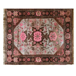 Elegant Rosé Reverie Knotted Wool Rug featuring a beautiful floral pattern in shades of pink and brown. This large living room area rug adds a touch of sophistication and warmth, making it an ideal choice for enhancing any space with its intricate design.