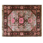Elegant Rosé Reverie Knotted Wool Rug featuring a beautiful floral pattern in shades of pink and brown. This large living room area rug adds a touch of sophistication and warmth, making it an ideal choice for enhancing any space with its intricate design.