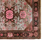 Top view of the Rosé Reverie Knotted Wool Rug, showcasing its intricate floral patterns in pink and brown tones. This area rug is perfect for adding elegance to living room spaces, ideal for those seeking large living room rugs with a floral design.