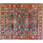 This beautiful hand-knotted area rug features a vibrant floral design with roses and lilies, ideal for large living rooms. The vintage rug's intricate patterns and rich colors evoke the elegance of Persian rugs, making it a stunning addition to any living space.