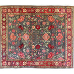 This beautiful hand-knotted area rug features a vibrant floral design with roses and lilies, ideal for large living rooms. The vintage rug's intricate patterns and rich colors evoke the elegance of Persian rugs, making it a stunning addition to any living space.
