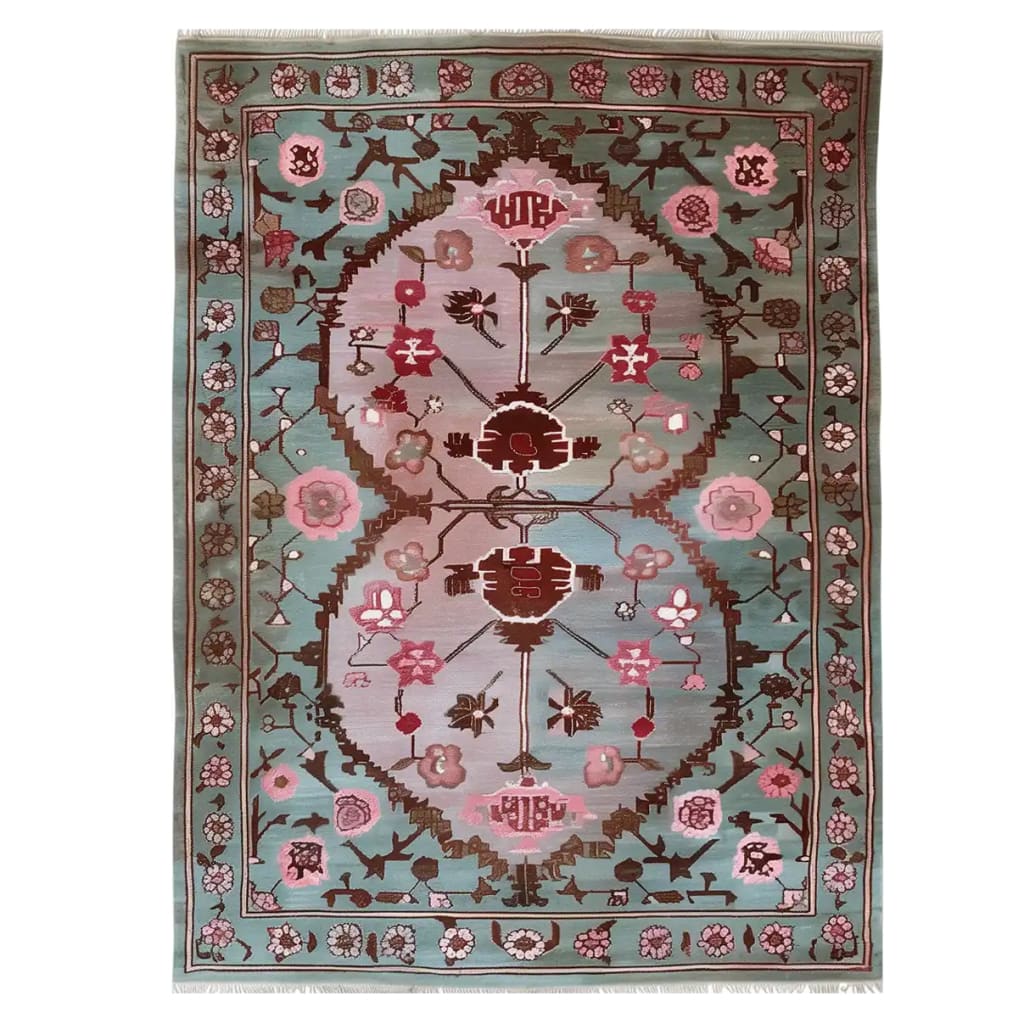 This beautiful area rug, titled 'Roses and Vines Knotted Wool Rug,' showcases a vibrant floral design with intricate patterns of pink and red flowers against a soothing blue background. Perfect for adding elegance to any space, this living room rug, measuring 8x10, combines style and comfort for your home decor.